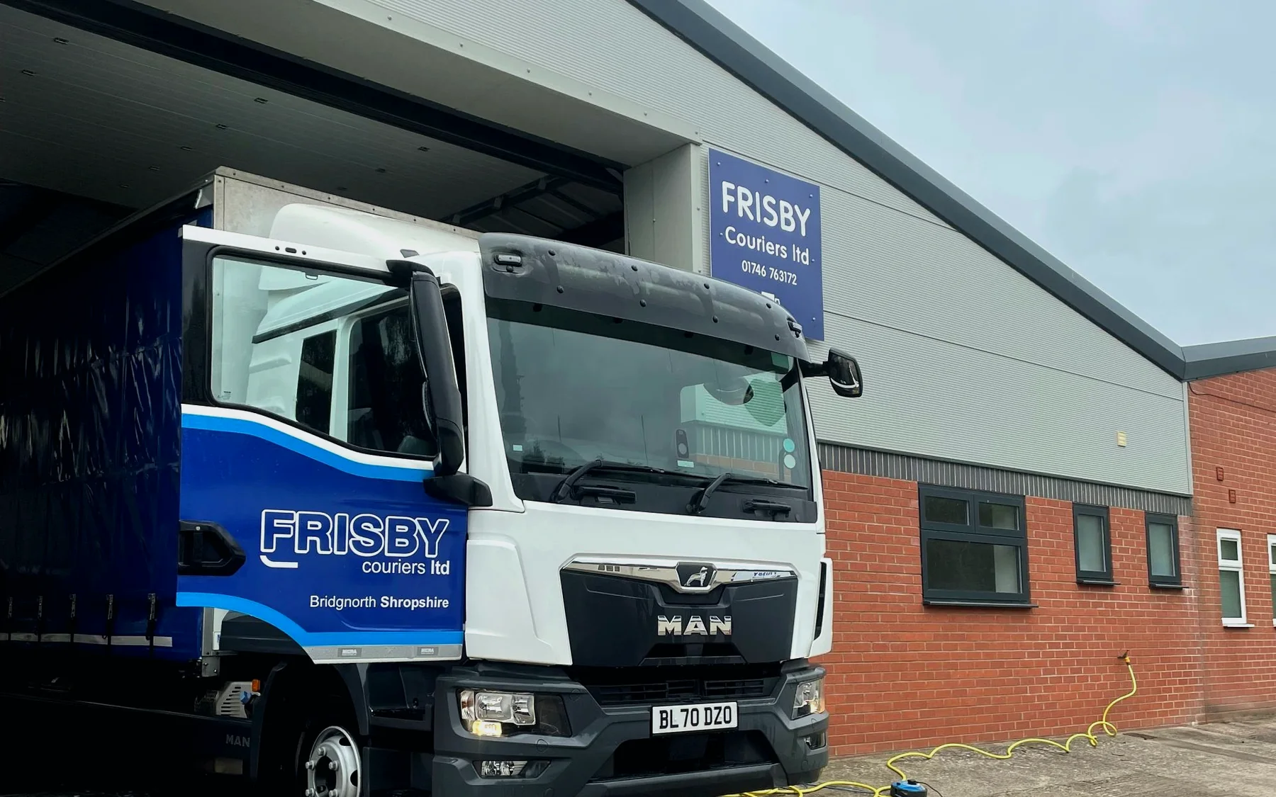 Frisby Couriers depot with branded lorry